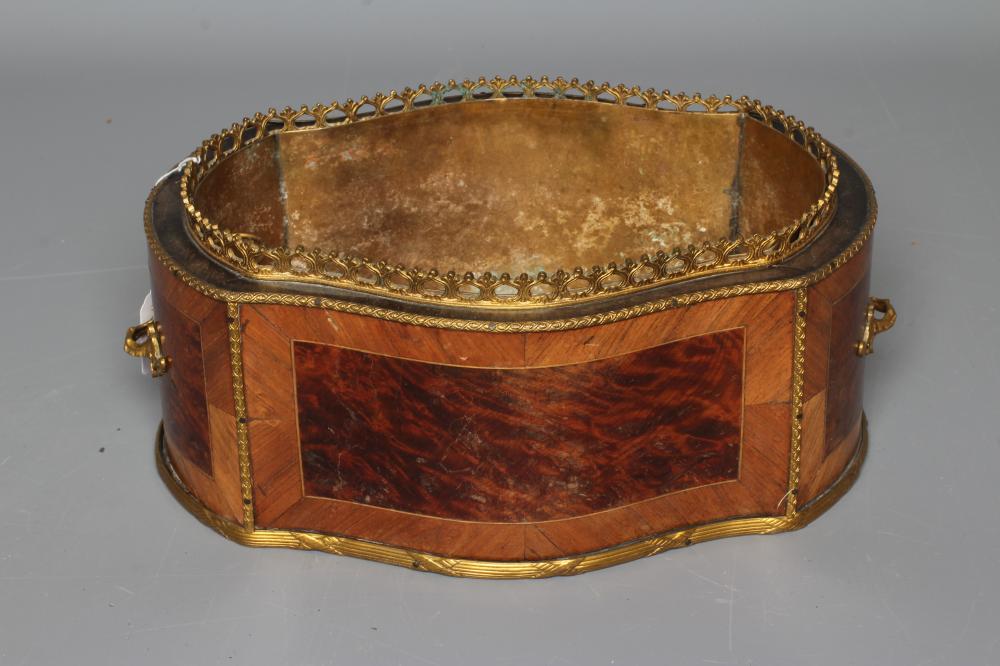 A LOUIS XV STYLE KINGWOOD AND BURR WALNUT JARDINIERE, early 20th century, of oval serpentine form Image
