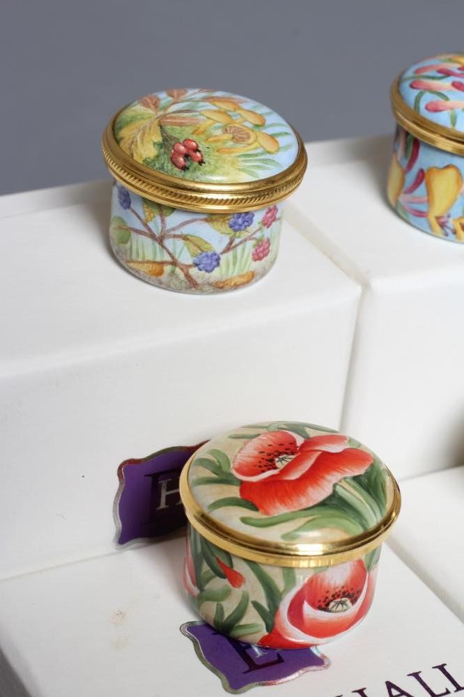 FOUR SMALL ELLIOT HALL ENAMEL BOXES AND COVERS comprising two painted by A. Roberts with Honeysuckle Image