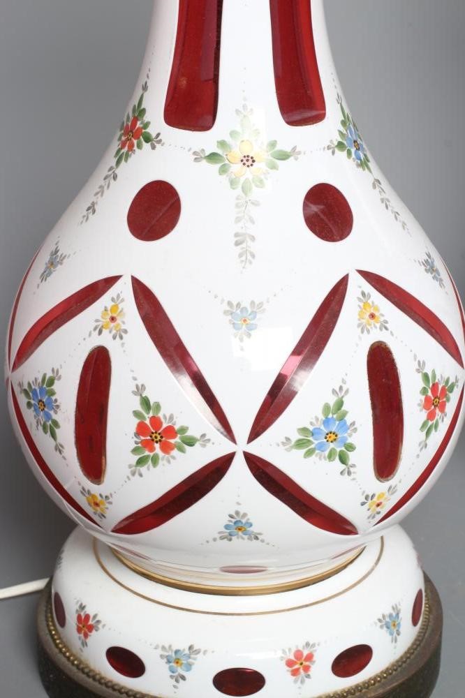 A PAIR OF WHITE OPAQUE OVERLAY CRANBERRY GLASS ELECTRIC TABLE LAMPS Image