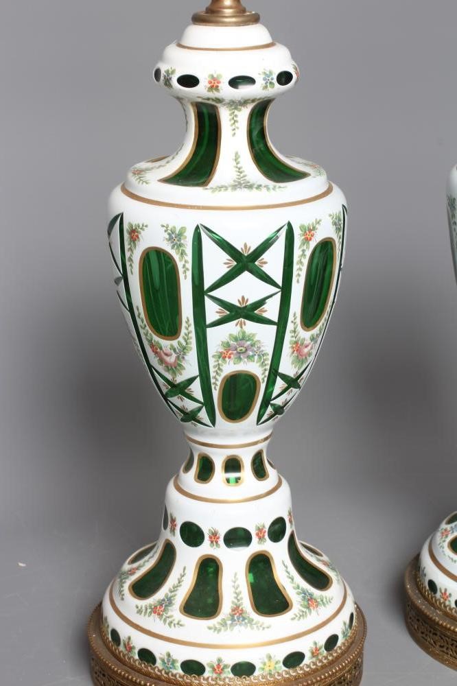 A PAIR OF WHITE OPAQUE OVERLAY GREEN GLASS ELECTRIC TABLE LAMPS Image