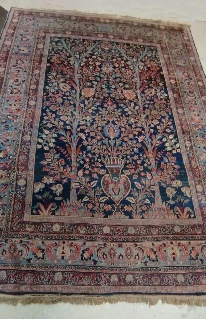 A PERSIAN CARPET, 20th century, the indigo field with Tree of Life style design within pale blue Image
