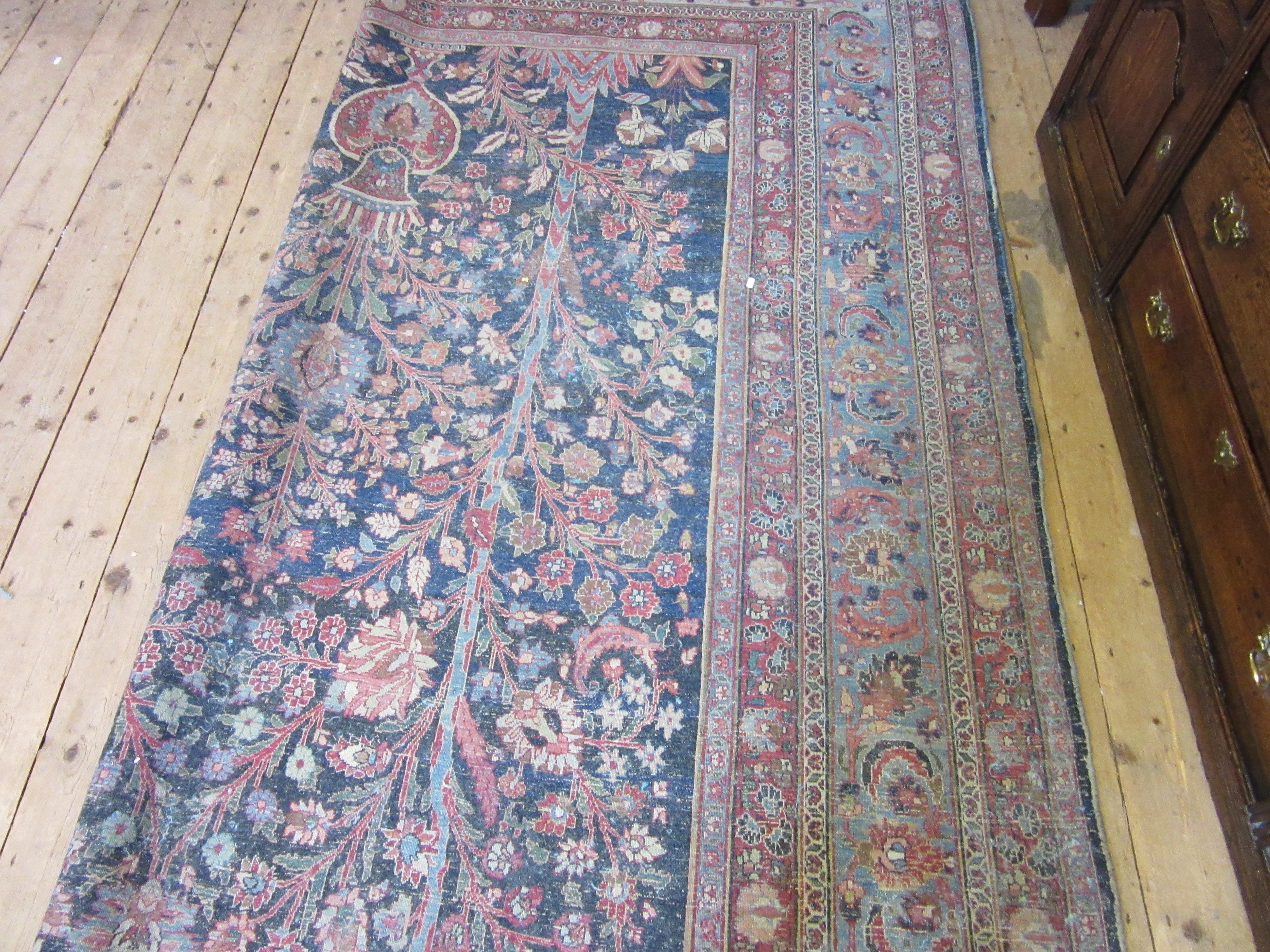 A PERSIAN CARPET, 20th century, the indigo field with Tree of Life style design within pale blue Image