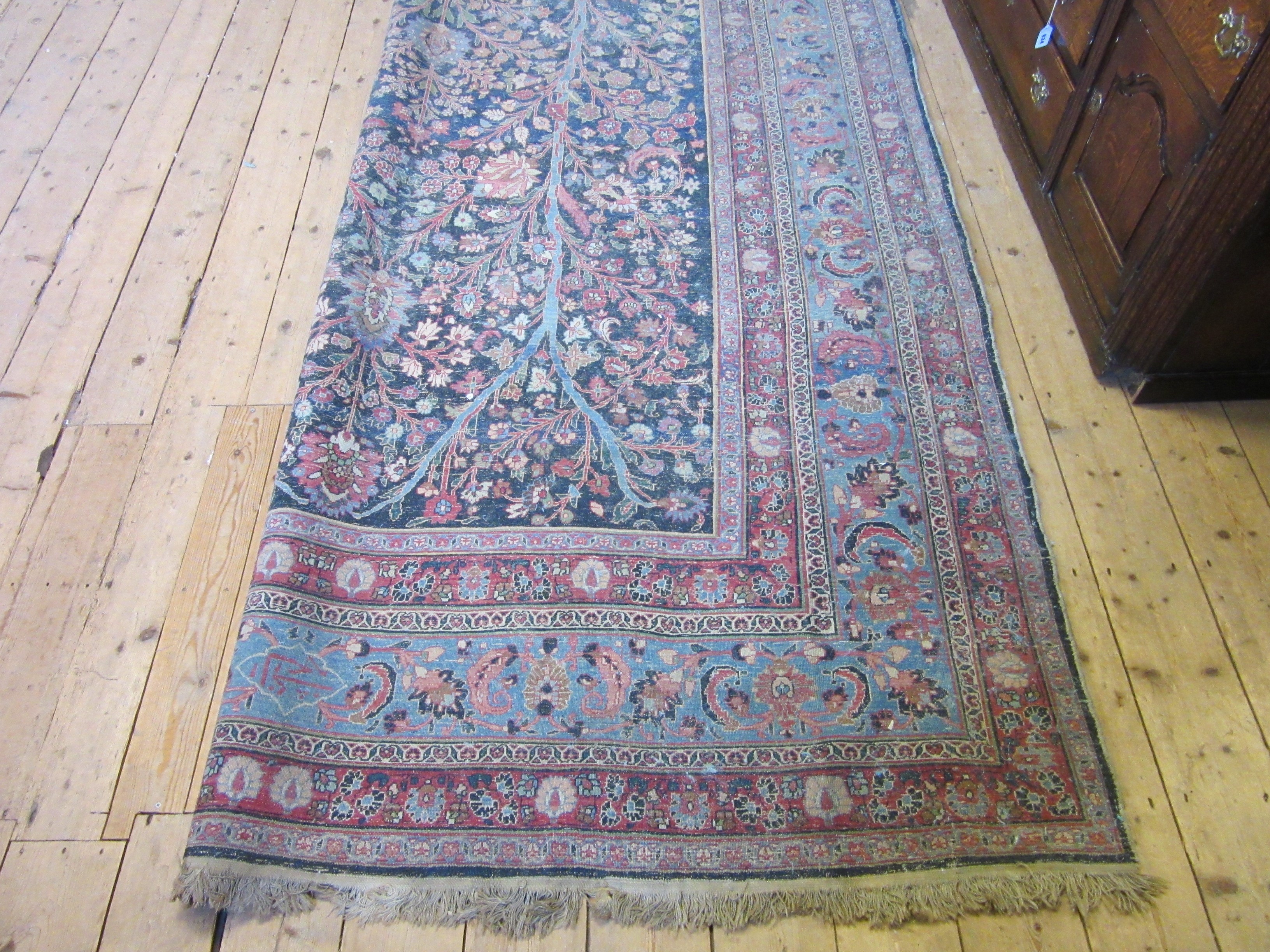 A PERSIAN CARPET, 20th century, the indigo field with Tree of Life style design within pale blue Image