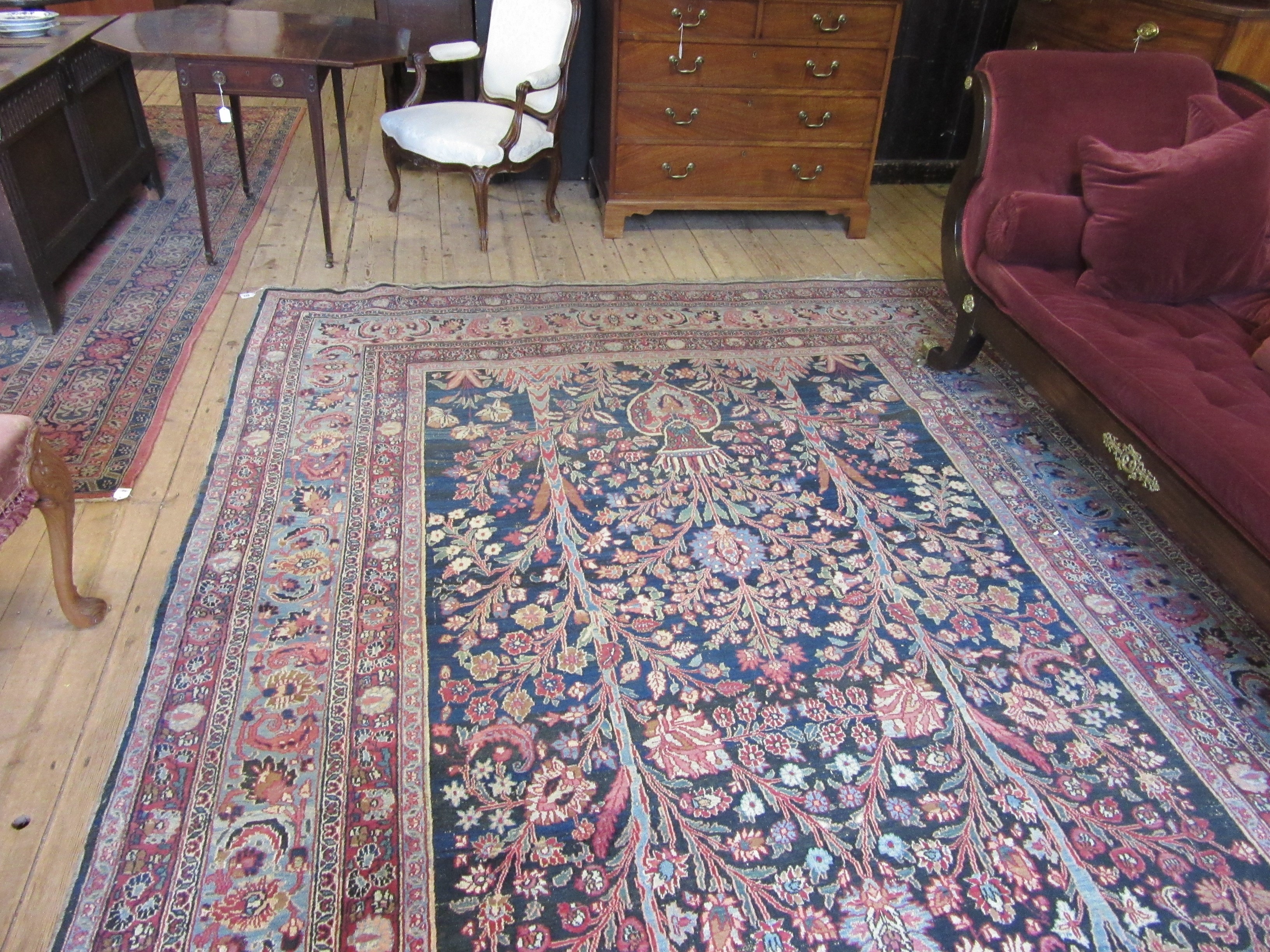 A PERSIAN CARPET, 20th century, the indigo field with Tree of Life style design within pale blue Image