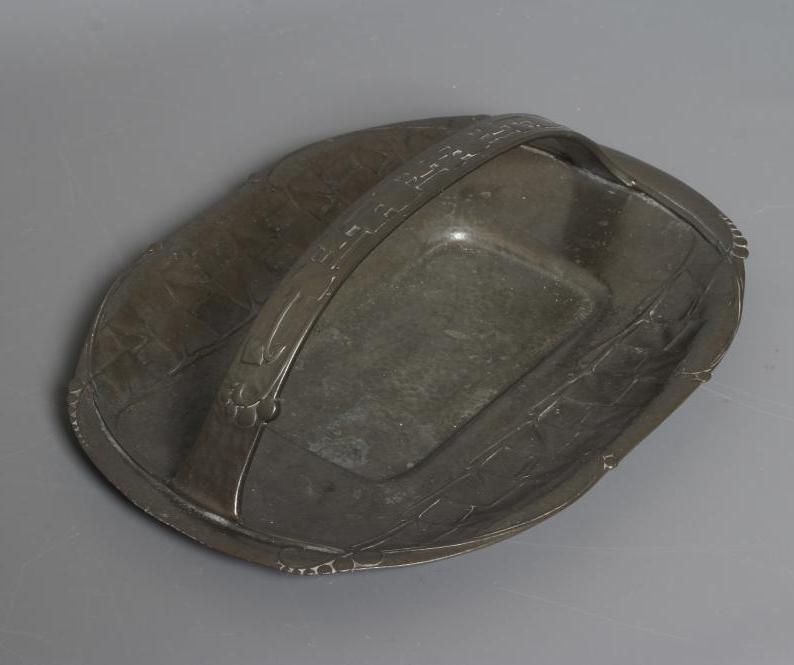 ARCHIBALD KNOX FOR LIBERTY - A TUDRIC PEWTER BASKET of shallow rounded oblong form with fixed Image