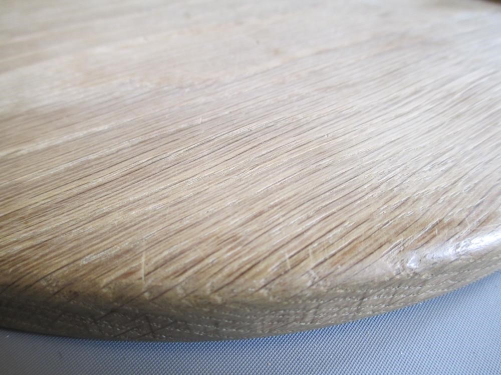 A ROBERT THOMPSON OAK CHEESEBOARD of oval form with carved mouse trademark in high relief, 14 1/2" Image