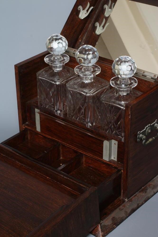 AN EDWARDIAN OAK AND BOXWOOD INLAID TANTALUS/GAMES COMPENDIUM Image