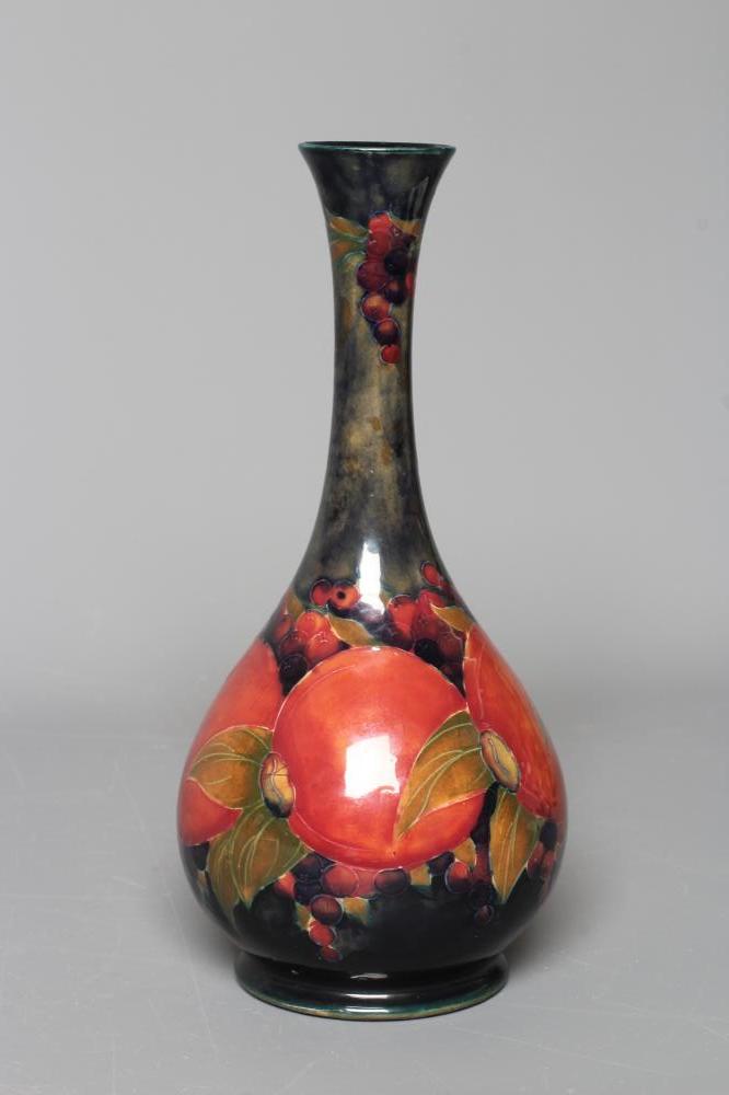 A MOORCROFT POTTERY POMEGRANATE PATTERN BOTTLE VASE, impressed Moorcroft, Burslem, England, 80, Image
