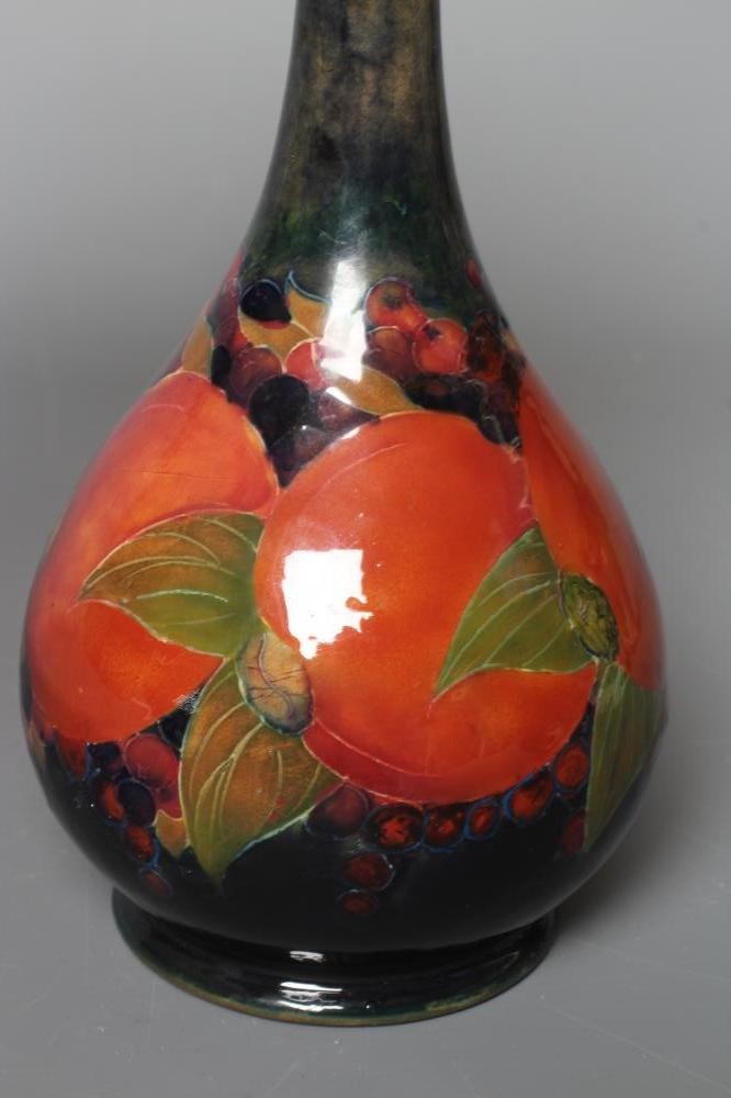 A MOORCROFT POTTERY POMEGRANATE PATTERN BOTTLE VASE, impressed Moorcroft, Burslem, England, 80, Image