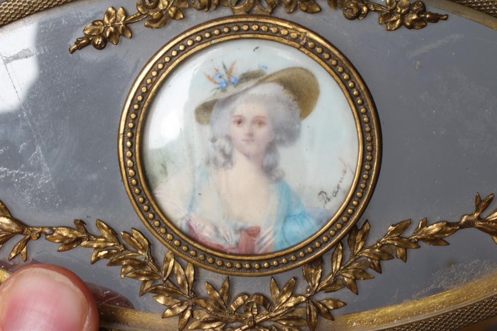A LOUIS XV STYLE GLASS AND GILT METAL MOUNTED OVAL TRINKET BOX Image