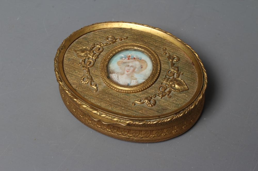 A LOUIS XV STYLE GLASS AND GILT METAL MOUNTED OVAL TRINKET BOX Image