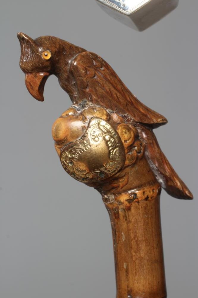 A 15CT GOLD MOUNTED BAMBOO STYLE WALKING CANE with exotic bird handle Image