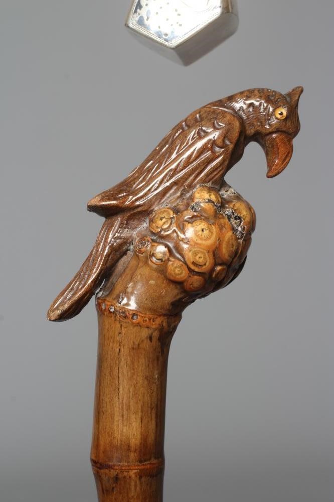 A 15CT GOLD MOUNTED BAMBOO STYLE WALKING CANE with exotic bird handle Image