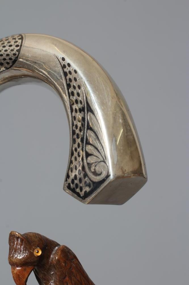 A 15CT GOLD MOUNTED BAMBOO STYLE WALKING CANE with exotic bird handle Image