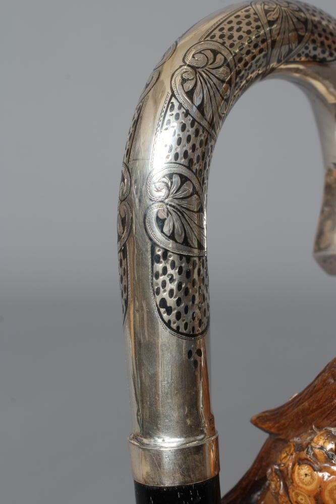 A 15CT GOLD MOUNTED BAMBOO STYLE WALKING CANE with exotic bird handle Image