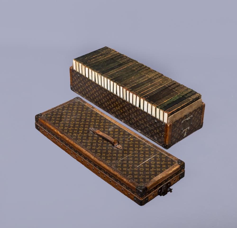 A LOUIS VUITTON LEATHER AND BRASS BOUND ENCYLOPEADIA BRITANNICA LIBRARY TRUNK Image