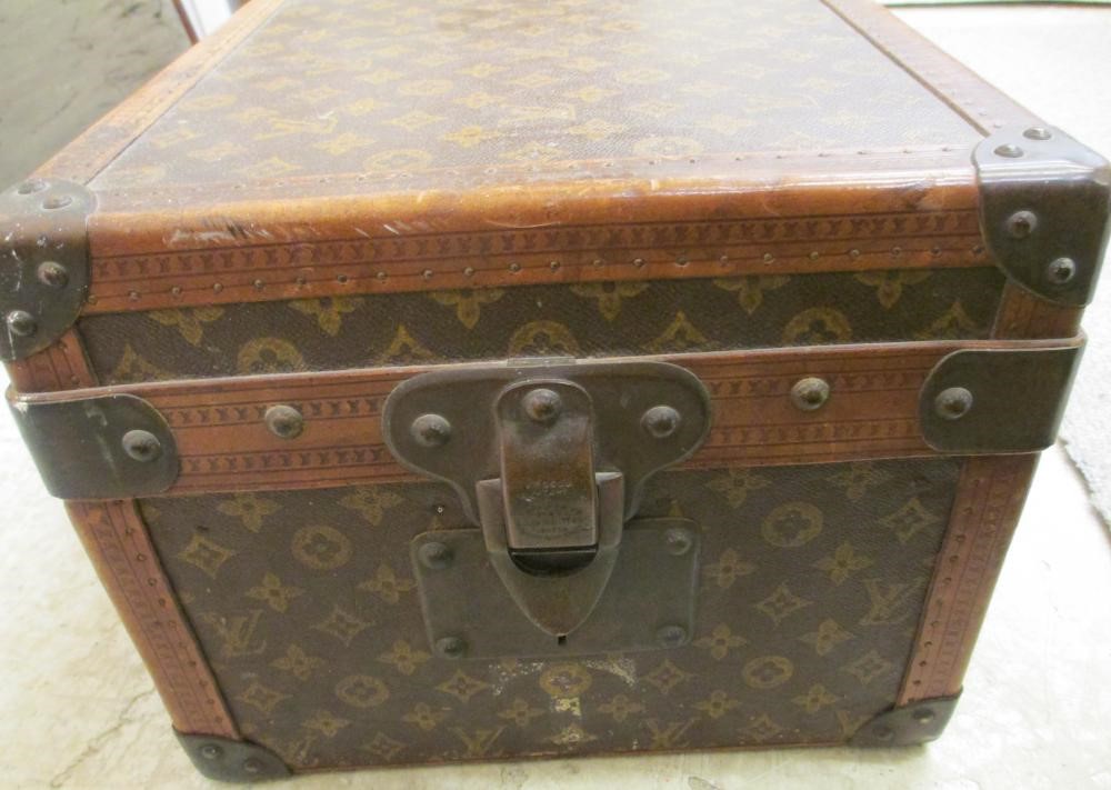 A LOUIS VUITTON LEATHER AND BRASS BOUND ENCYLOPEADIA BRITANNICA LIBRARY TRUNK Image