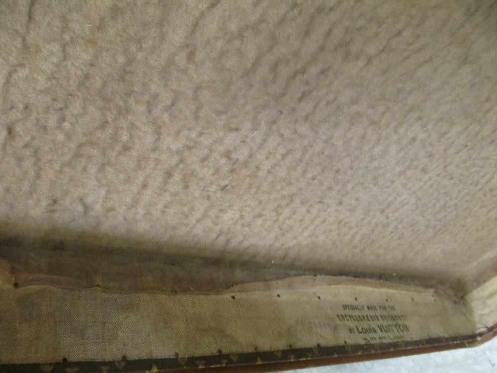 A LOUIS VUITTON LEATHER AND BRASS BOUND ENCYLOPEADIA BRITANNICA LIBRARY TRUNK Image