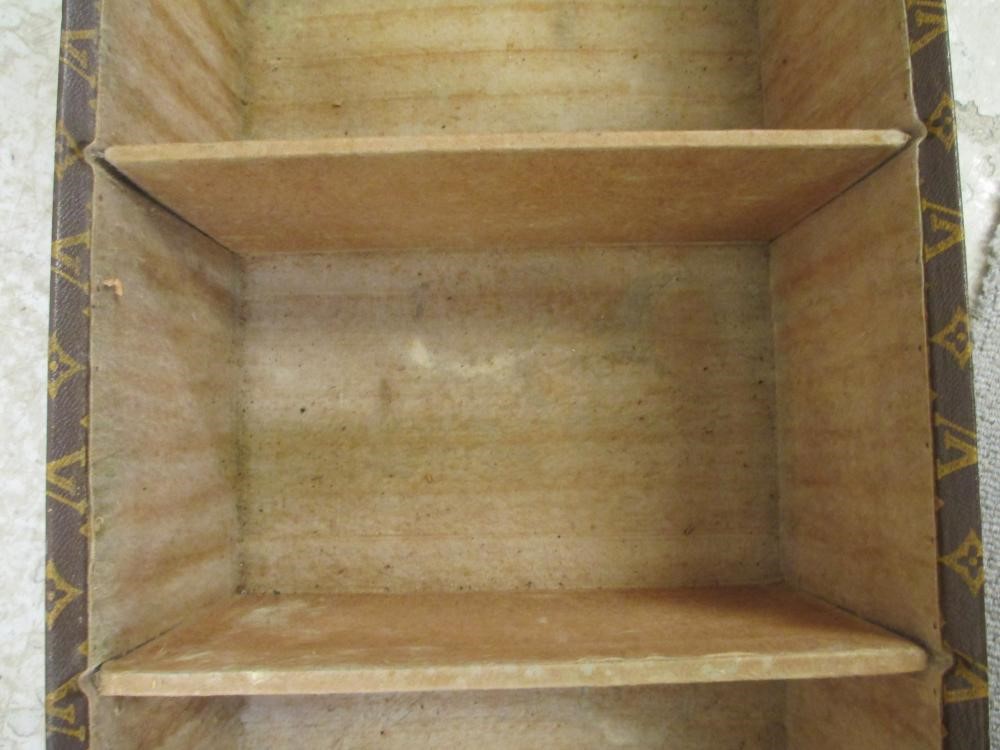 A LOUIS VUITTON LEATHER AND BRASS BOUND ENCYLOPEADIA BRITANNICA LIBRARY TRUNK Image