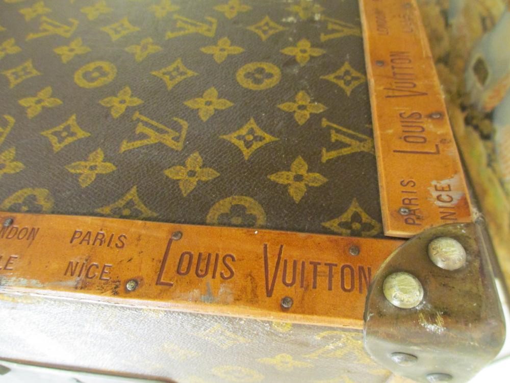 A LOUIS VUITTON LEATHER AND BRASS BOUND ENCYLOPEADIA BRITANNICA LIBRARY TRUNK Image