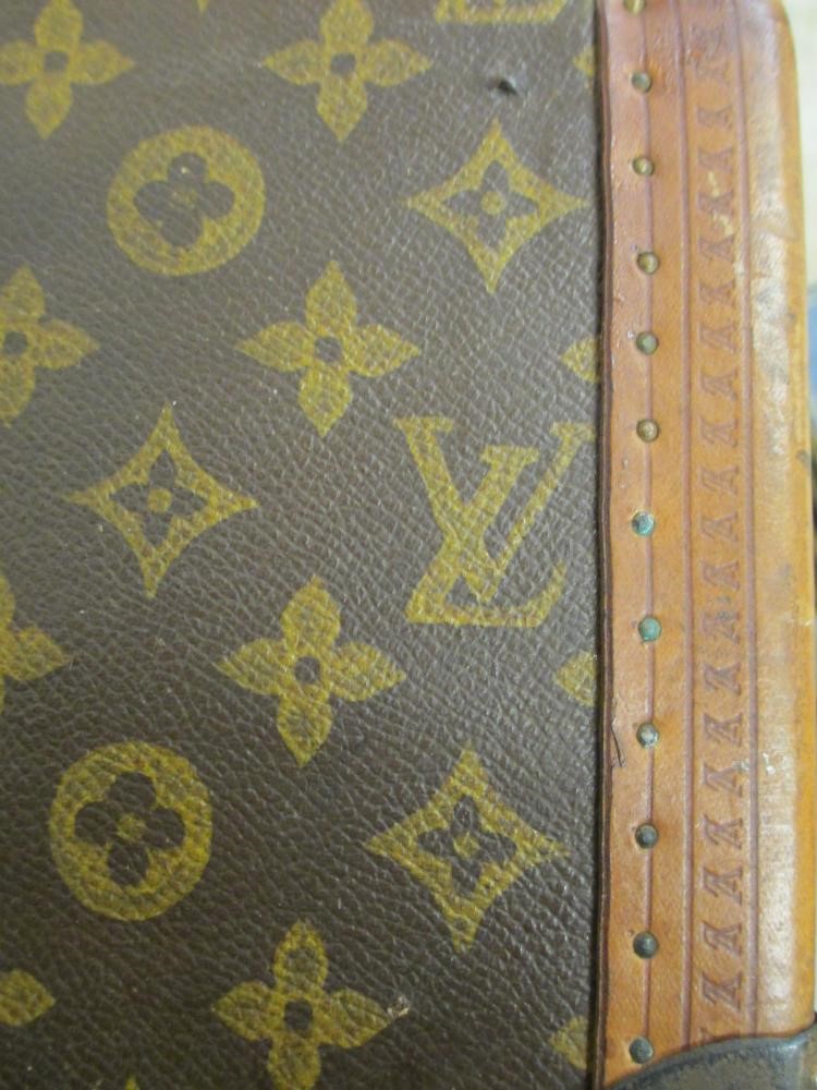 A LOUIS VUITTON LEATHER AND BRASS BOUND ENCYLOPEADIA BRITANNICA LIBRARY TRUNK Image
