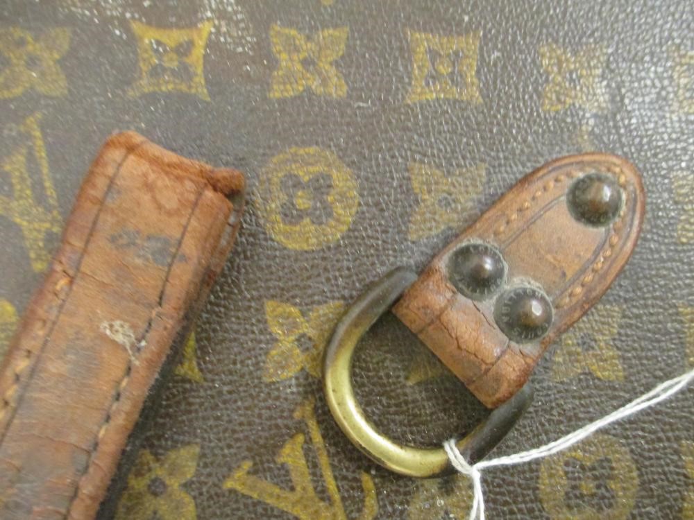 A LOUIS VUITTON LEATHER AND BRASS BOUND ENCYLOPEADIA BRITANNICA LIBRARY TRUNK Image