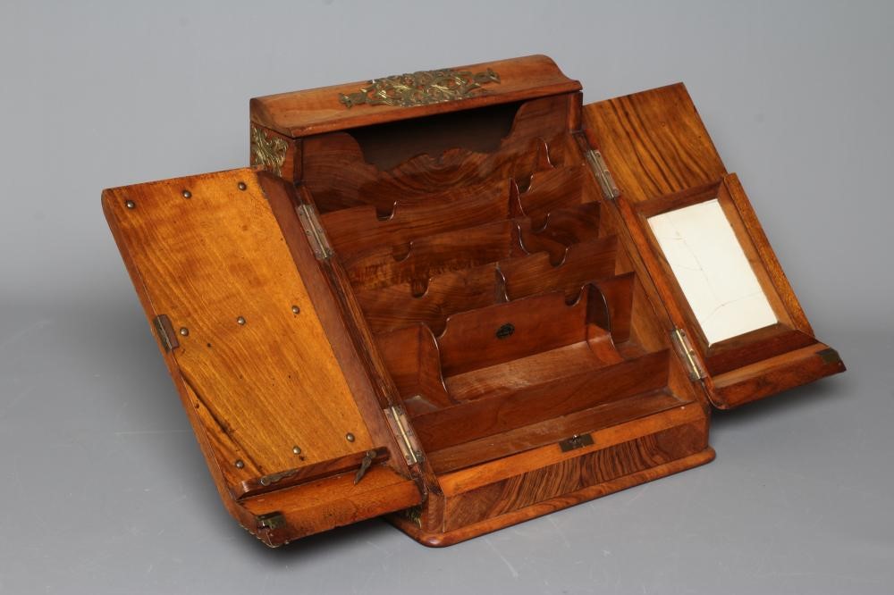 A VICTORIAN BURR WALNUT AND BRASS CORRESPONDENCE BOX with twin sloping doors concealing a fitted Image