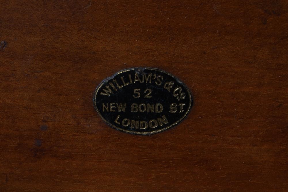 A VICTORIAN BURR WALNUT AND BRASS CORRESPONDENCE BOX with twin sloping doors concealing a fitted Image