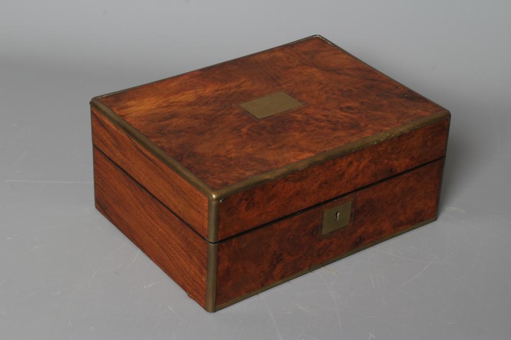 A VICTORIAN OBLONG BURR WALNUT AND BRASS BOUND TRAVELLING VANITY BOX with blue velvet lined fitted Image