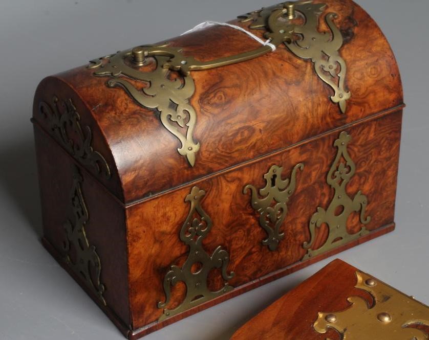 A VICTORIAN WALNUT STATIONERY CASKET of oblong form with brass mounts Image