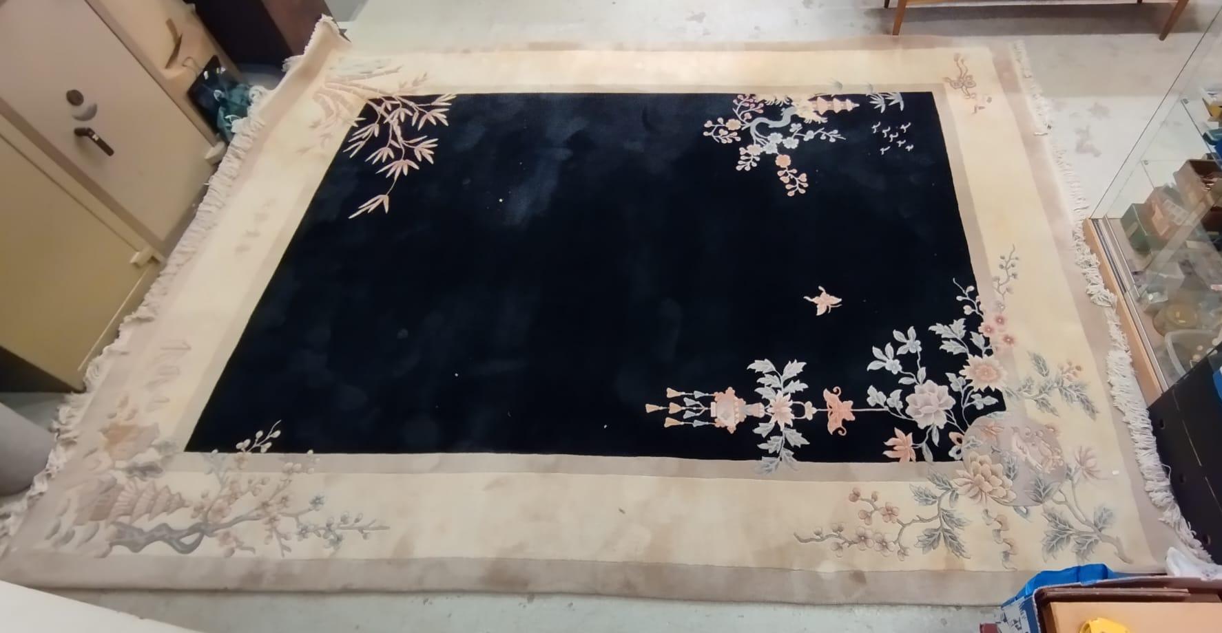 A CHINESE WASHED AND FRINGED CARPET, modern, the black field within a two tone champagne border, Image