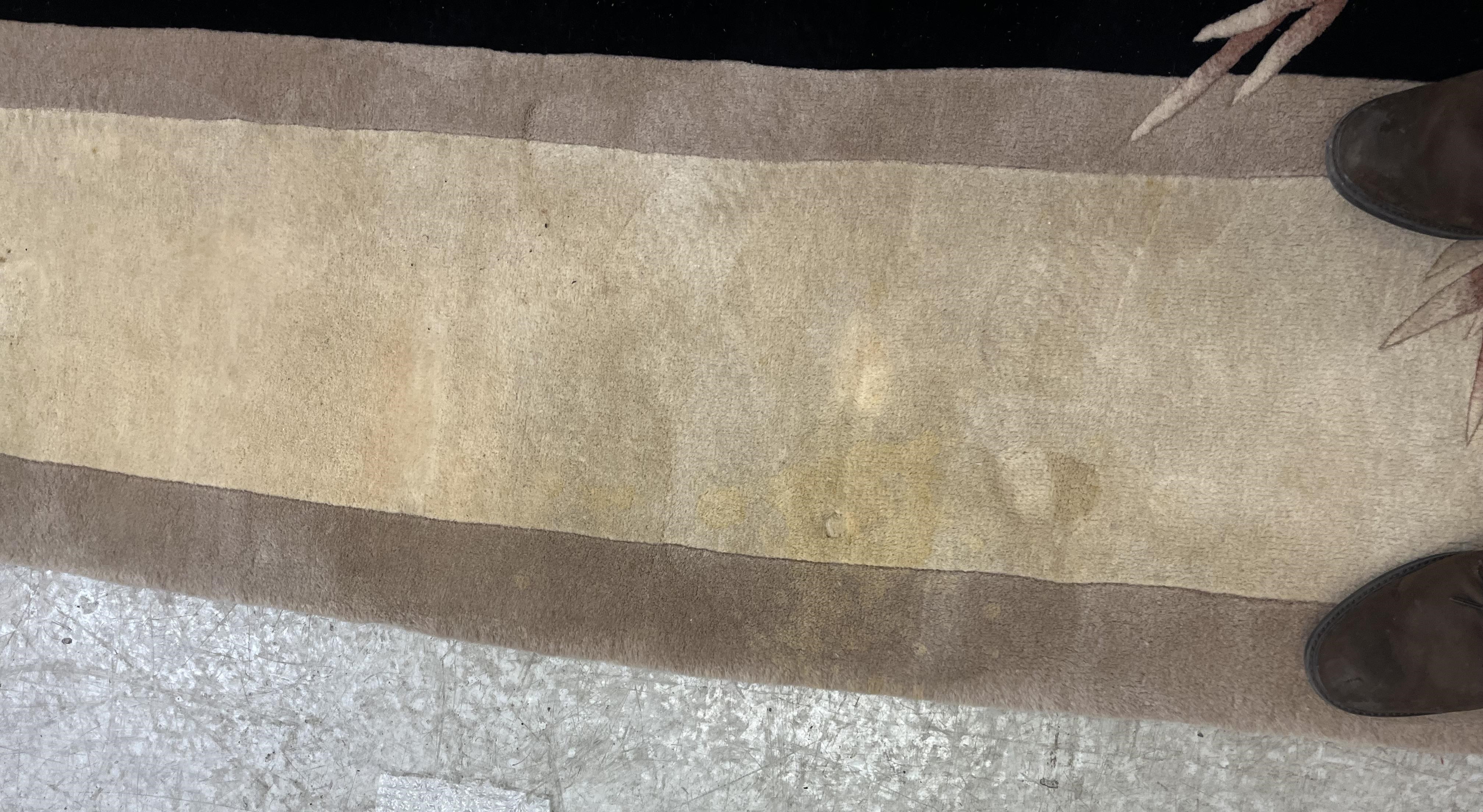 A CHINESE WASHED AND FRINGED CARPET, modern, the black field within a two tone champagne border, Image