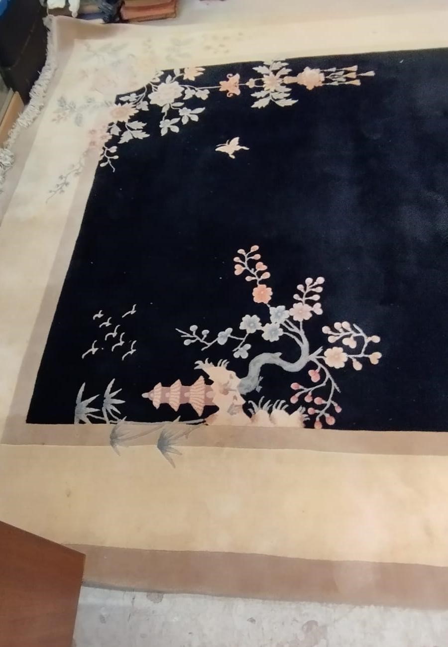 A CHINESE WASHED AND FRINGED CARPET, modern, the black field within a two tone champagne border, Image