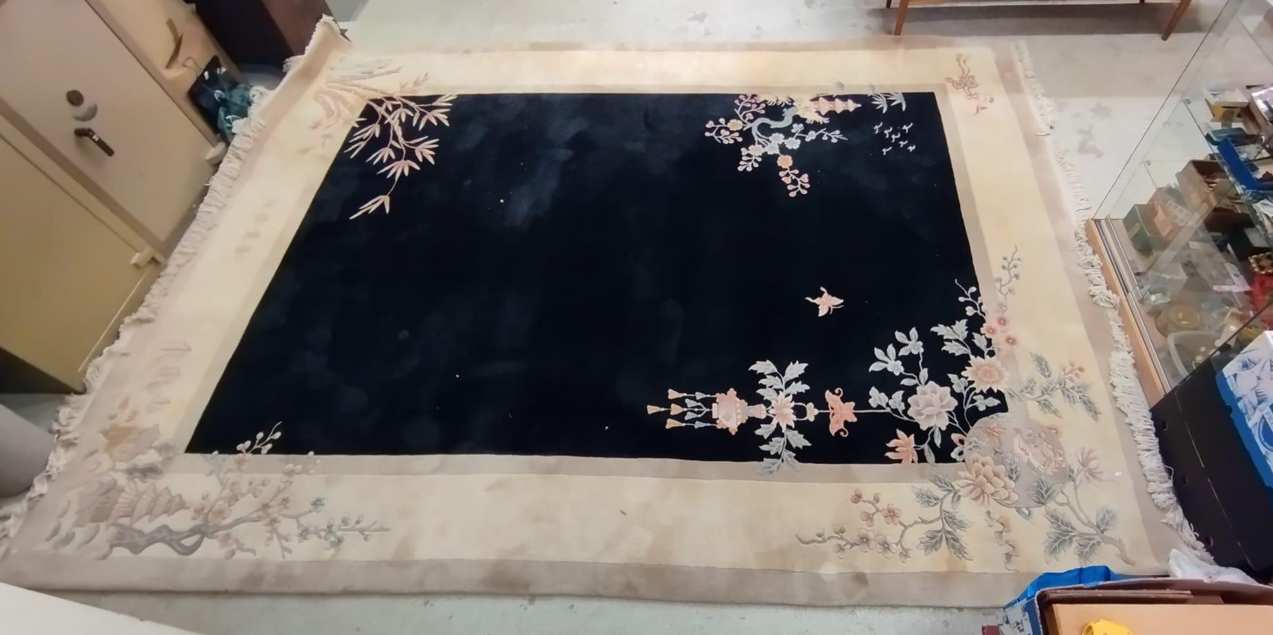 A CHINESE WASHED AND FRINGED CARPET, modern, the black field within a two tone champagne border, Image