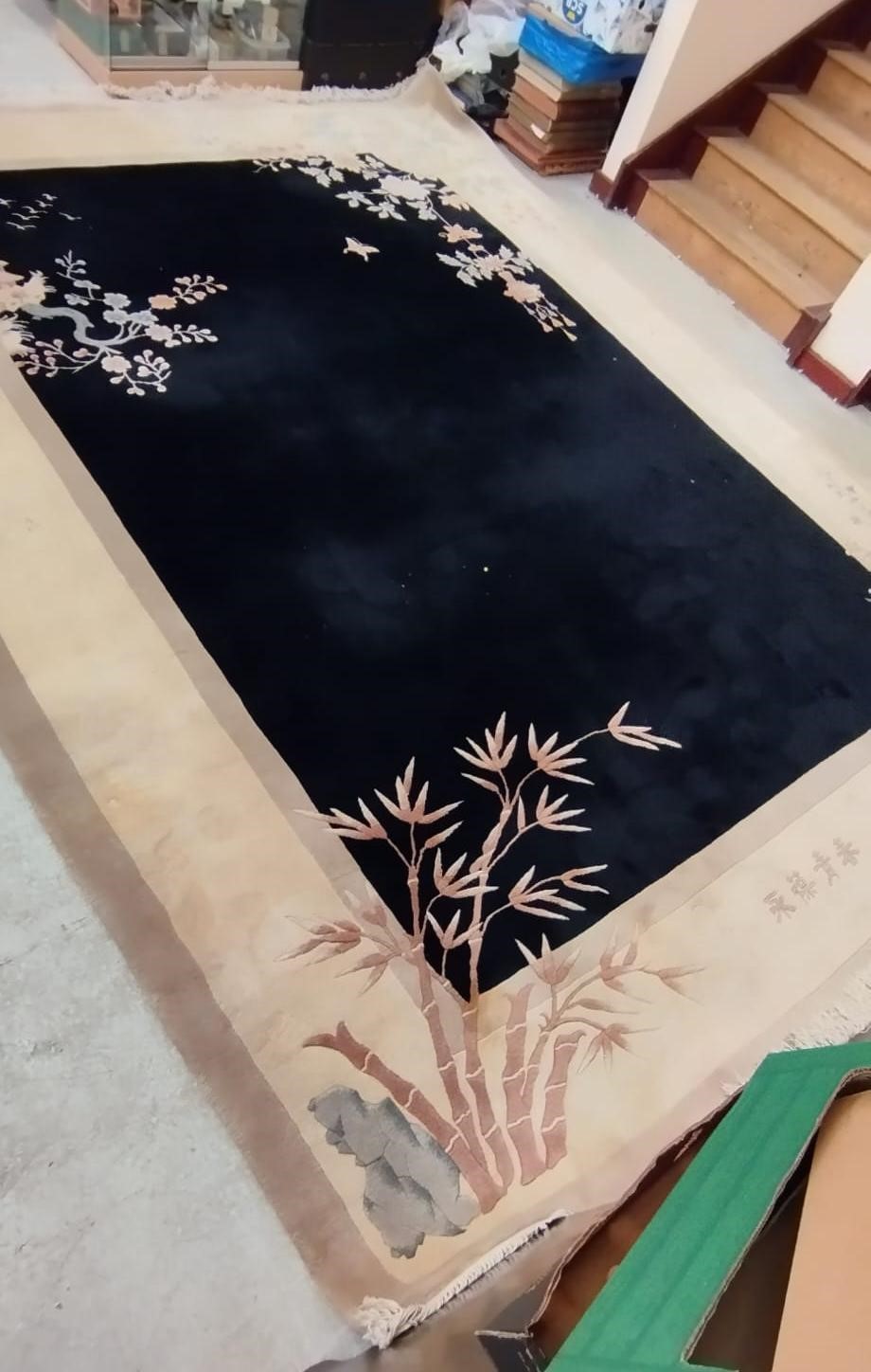 A CHINESE WASHED AND FRINGED CARPET, modern, the black field within a two tone champagne border, Image