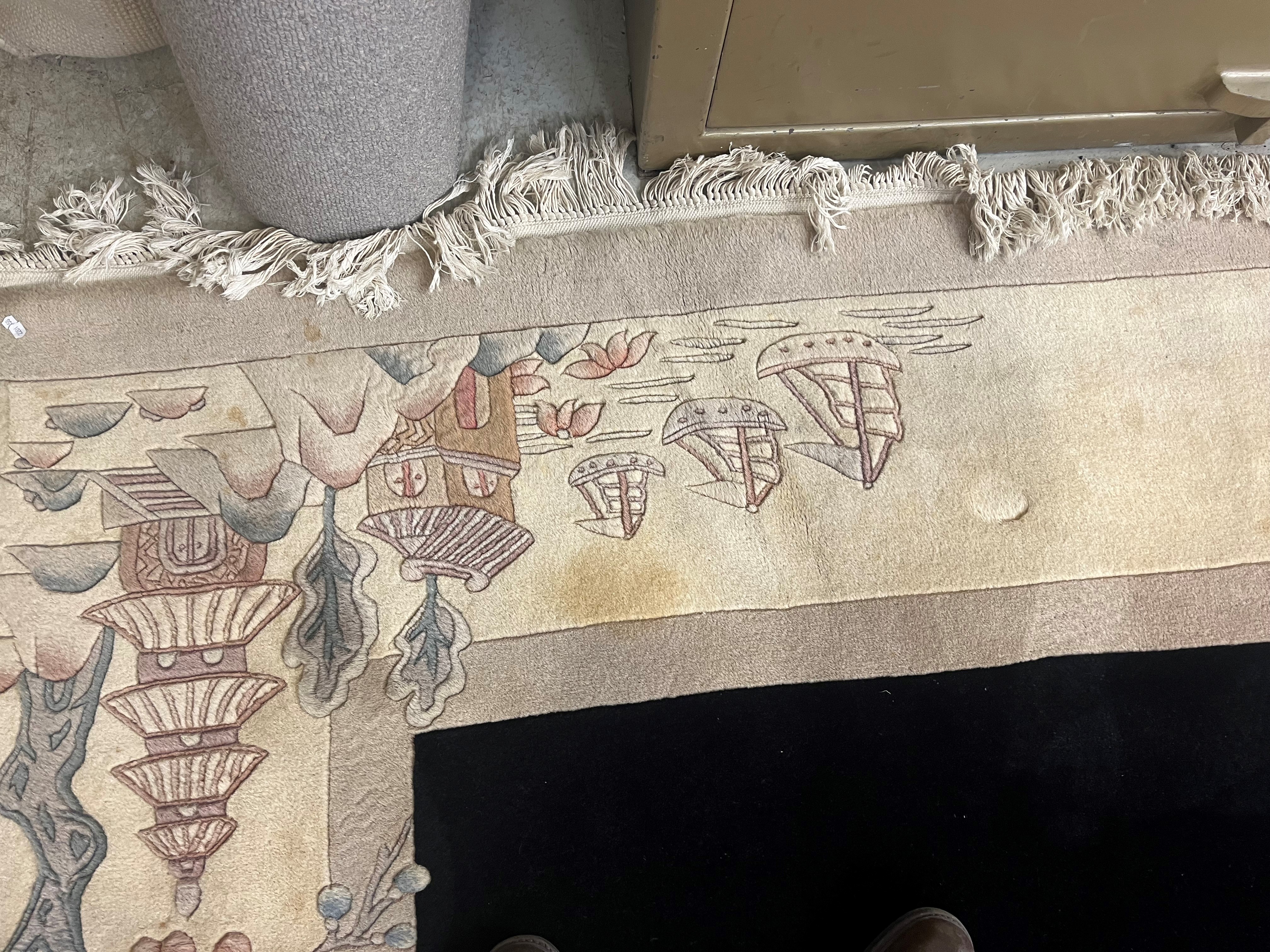 A CHINESE WASHED AND FRINGED CARPET, modern, the black field within a two tone champagne border, Image