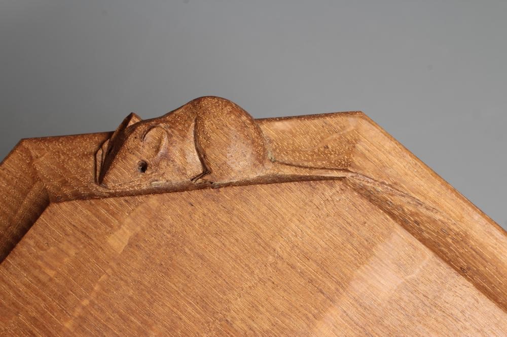 A ROBERT THOMPSON OAK CHEESE BOARD of oblong form with canted edges and mouse trademark carved in Image