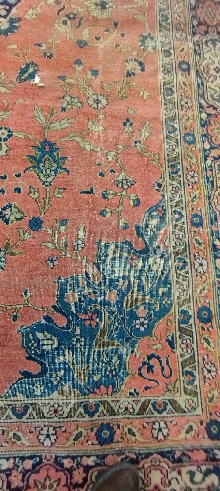 A PERSIAN CARPET, 20th century, the dusky pink field with scattered flowerheads, navy blue central Image