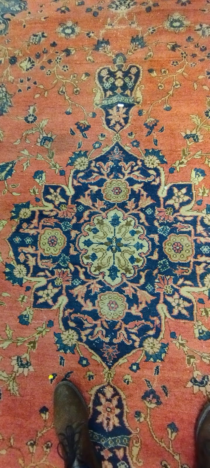 A PERSIAN CARPET, 20th century, the dusky pink field with scattered flowerheads, navy blue central Image