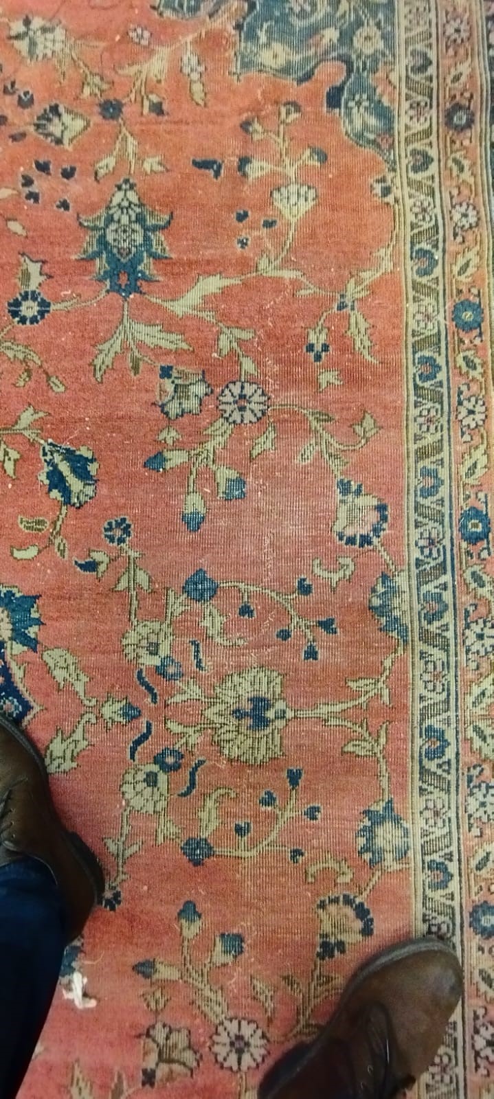 A PERSIAN CARPET, 20th century, the dusky pink field with scattered flowerheads, navy blue central Image