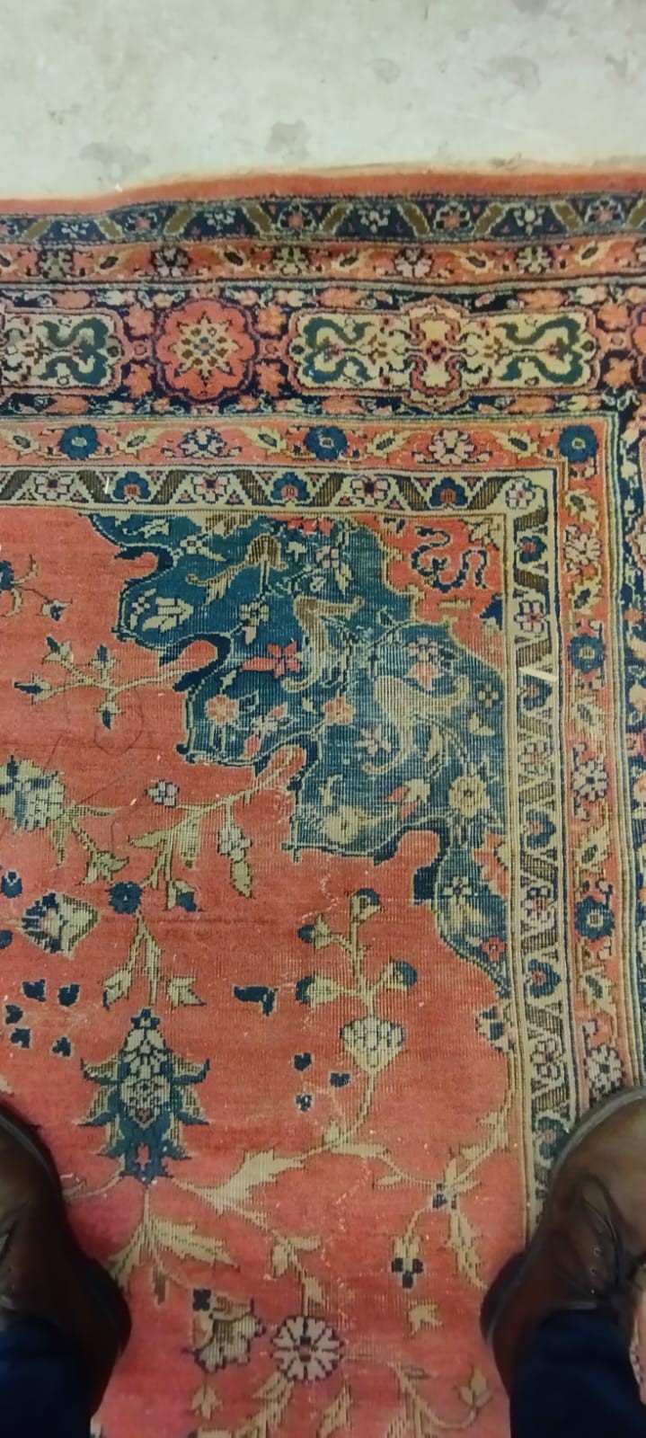 A PERSIAN CARPET, 20th century, the dusky pink field with scattered flowerheads, navy blue central Image