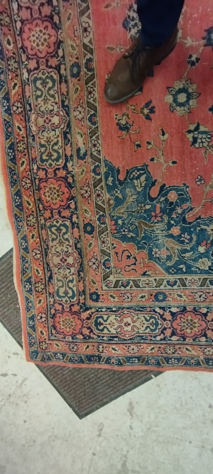 A PERSIAN CARPET, 20th century, the dusky pink field with scattered flowerheads, navy blue central Image