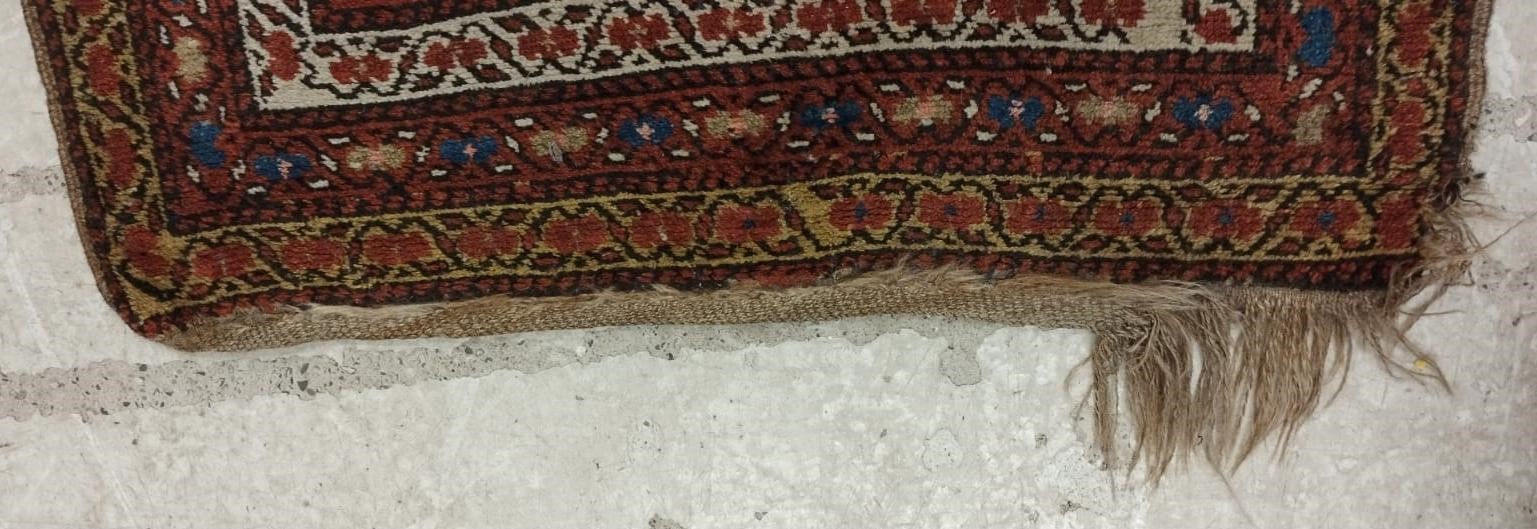 A NORTH WEST PERSIAN RUNNER, c.1900, the madder red field with two guls in shades of blue, red pale Image