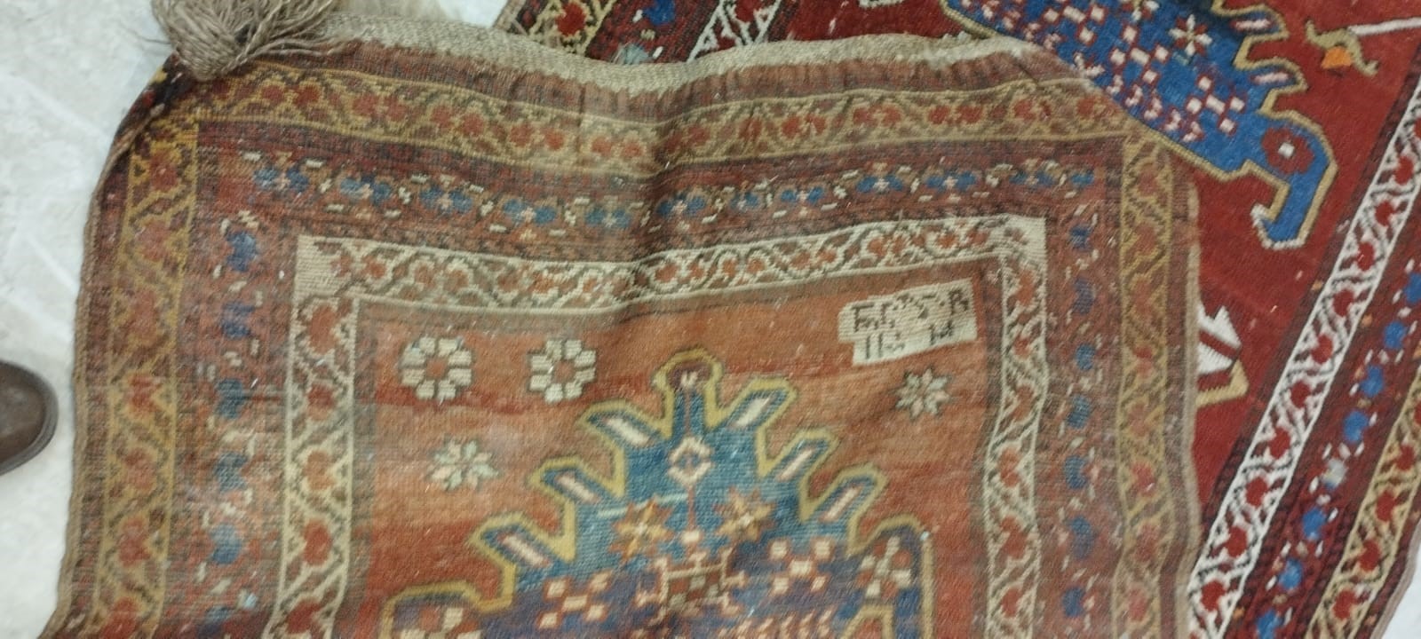A NORTH WEST PERSIAN RUNNER, c.1900, the madder red field with two guls in shades of blue, red pale Image