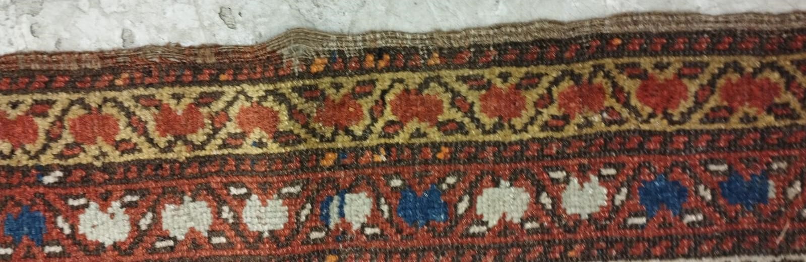 A NORTH WEST PERSIAN RUNNER, c.1900, the madder red field with two guls in shades of blue, red pale Image