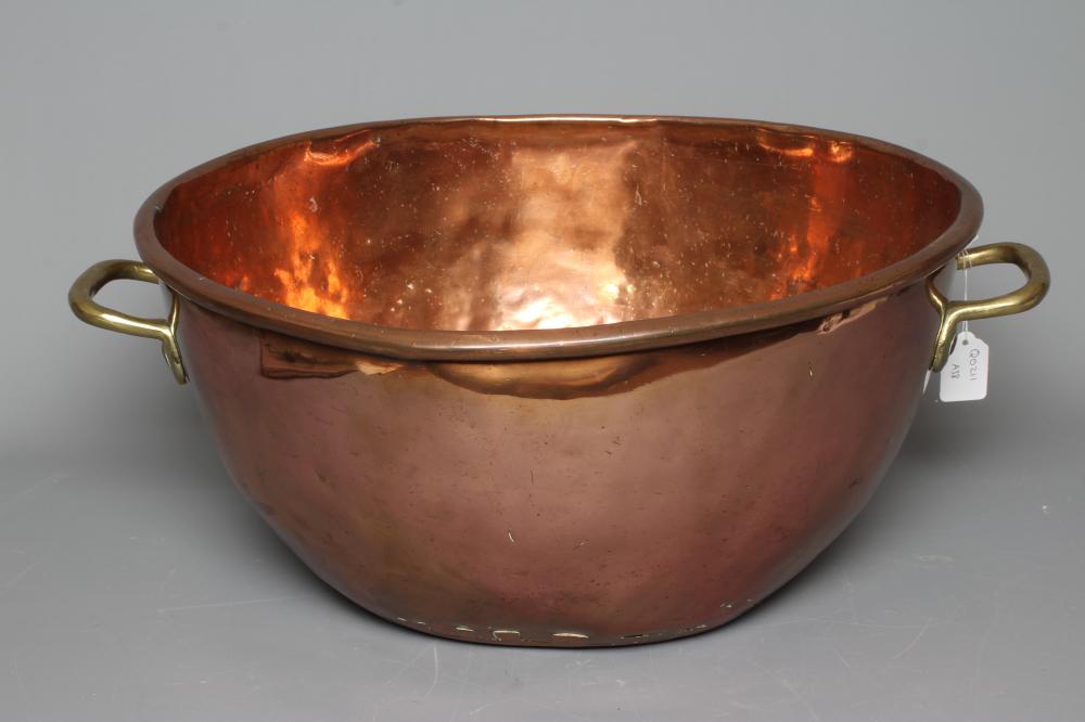 A VICTORIAN COPPER AND BRASS BASIN of two handled deep circular form, 9 3/4" high, 21 3/4" diameter Image