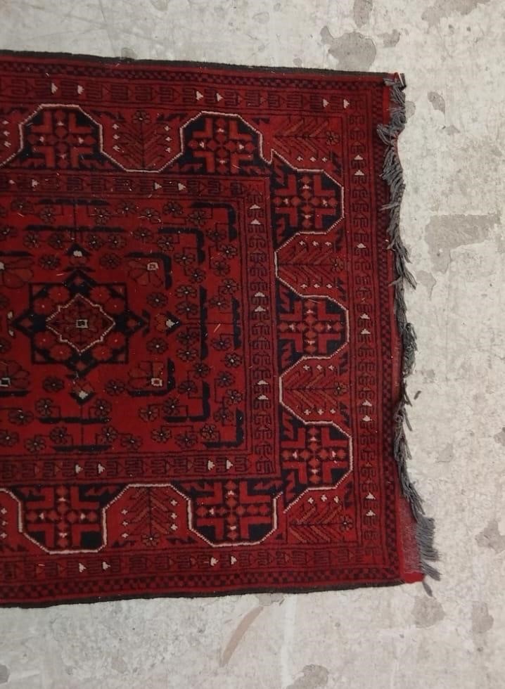 A PERSIAN STYLE RUNNER, second half 20th century, the red field with seven linked guls in navy and Image