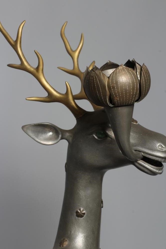A CHINESE GREY PATINATED SPELTER FAWN CANDLE HOLDER, modern, with detachable antlers and studded Image