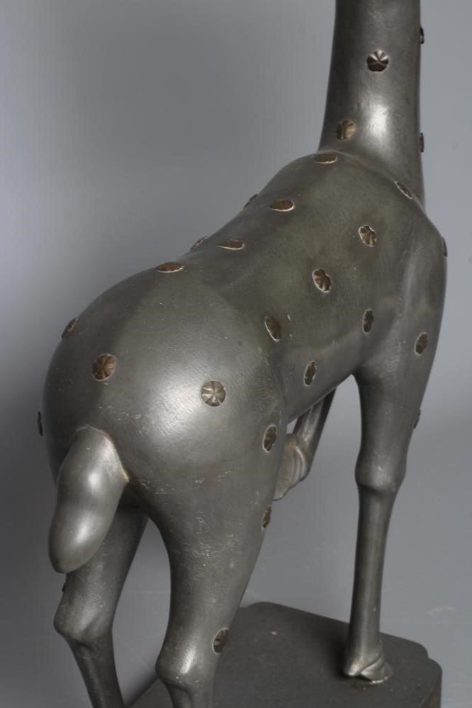 A CHINESE GREY PATINATED SPELTER FAWN CANDLE HOLDER, modern, with detachable antlers and studded Image