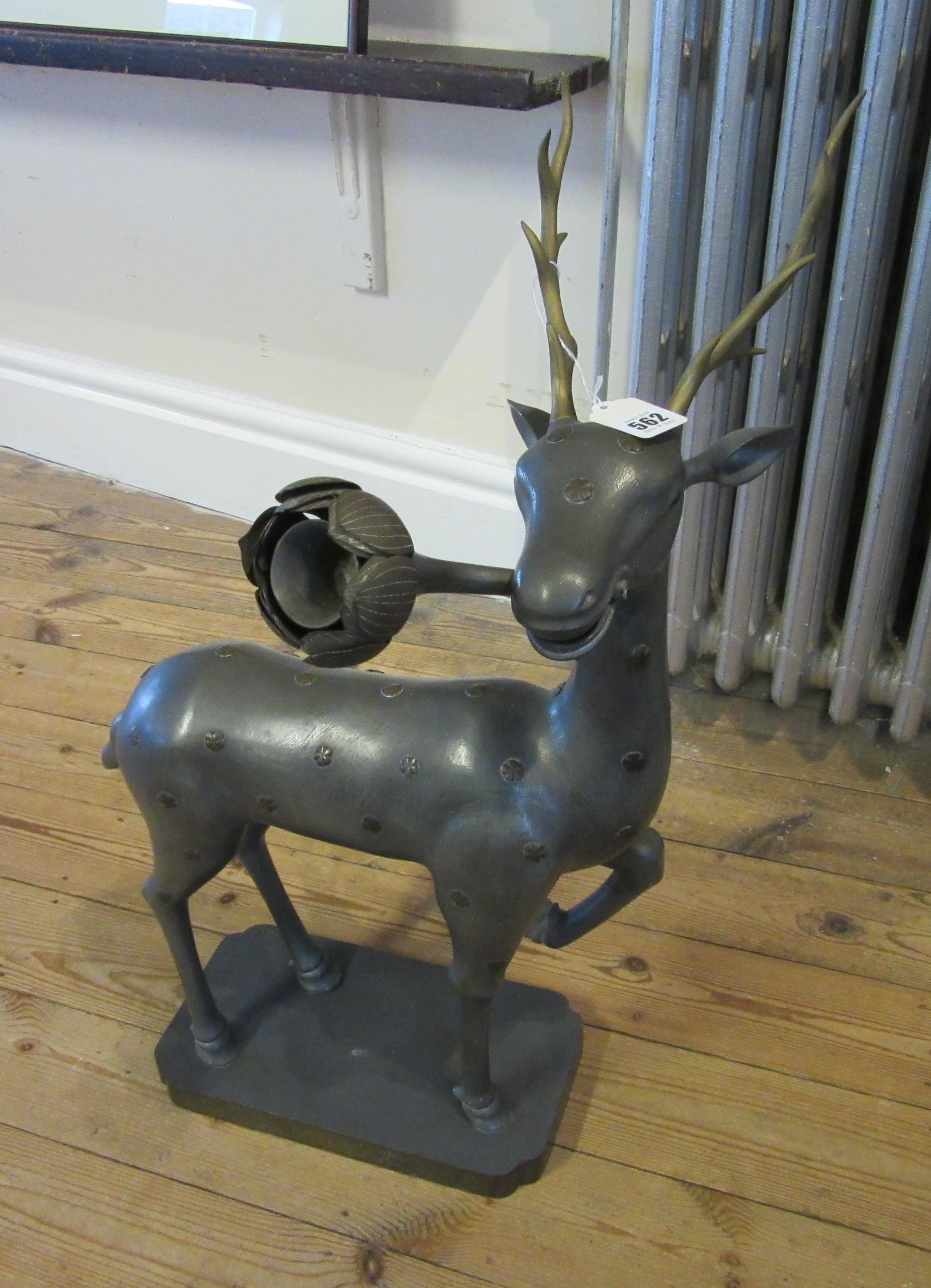 A CHINESE GREY PATINATED SPELTER FAWN CANDLE HOLDER, modern, with detachable antlers and studded Image